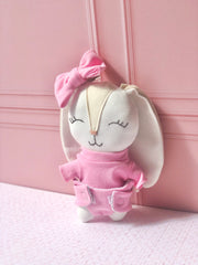 Sonaja en forma de conejo con moño en tono rosa (15 cm)