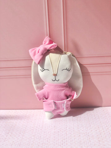 Sonaja en forma de conejo con moño en tono rosa (15 cm)