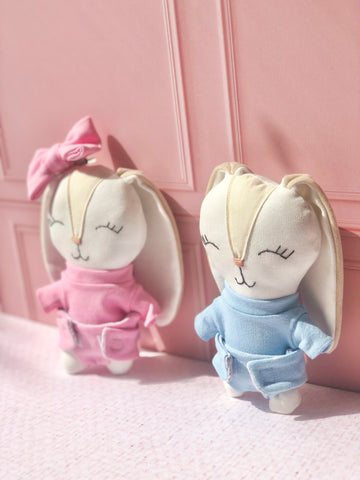 Sonaja en forma de conejo con moño en tono rosa (15 cm)