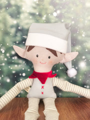 Duende niño elf navideño en tonos neutros pelo cafe obscuro