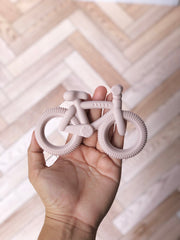 Mordedera en forma de bicicleta ( 3 colores)