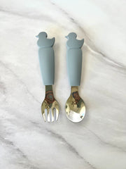 Cubiertos de silicón y acero en forma de patito (Gris y beige)