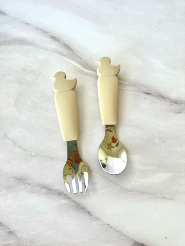 Cubiertos de silicón y acero en forma de patito (Gris y beige)